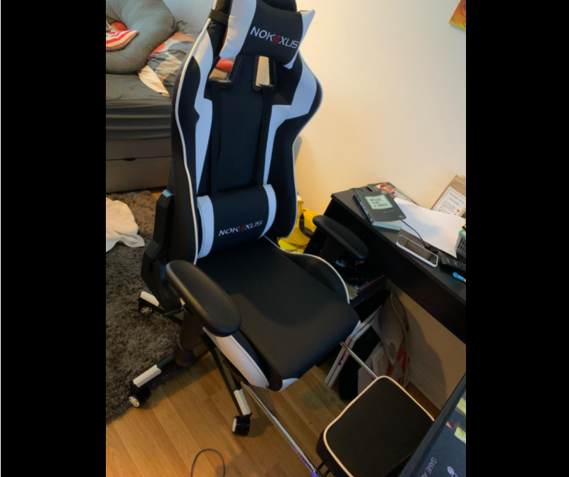Nokaxus Gaming Chair Black color with footrest out